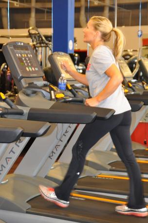 A WOMAN who claims she ended up in hospital after being thrown from a faulty treadmill is taking legal action against her gym.